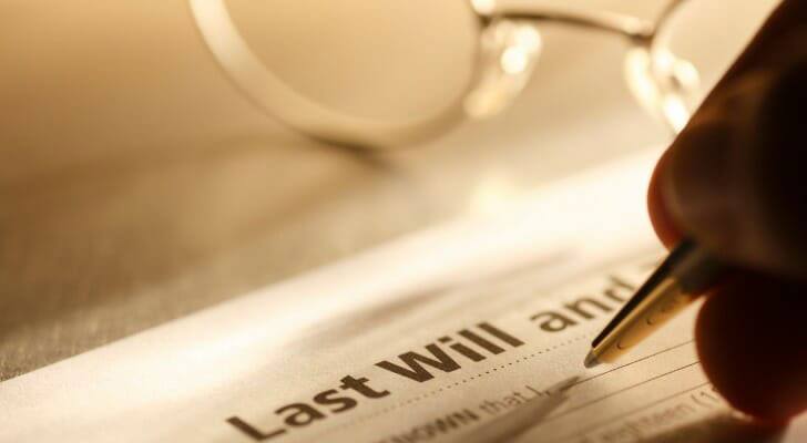 A person writing his last will and testament | Outlook Wealth Advisors