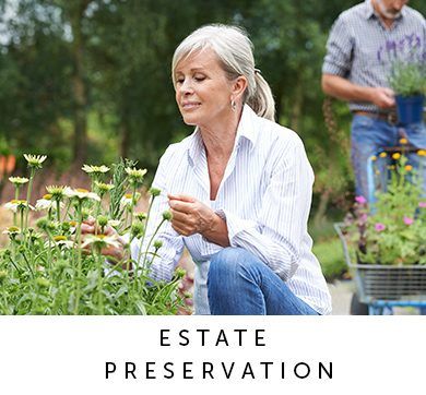 A senior couple enjoying their time in a flower garden while Outlook Wealth Advisors made a properly structured estate plan for them.